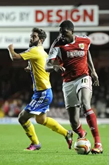 Images Dated 22nd October 2013: Bristol City's Jay Emmanuel-Thomas Outmaneuvers Brentford's Will Grigg in Sky Bet League One Clash