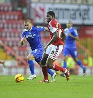 Images Dated 2nd November 2013: Bristol City's Jay Emmanuel-Thomas Outmaneuvers Oldham Athletic's James Wesolowski in Sky Bet