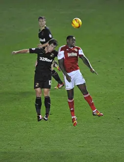 Bristol City V Crawley Town Prints: Bristol City's Jay Emmanuel-Thomas Soars Above Crawley Town's Joe Walsh in Intense Football Clash