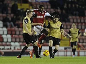 Images Dated 26th November 2013: Bristol City's Jay Emmanuel-Thomas Tries to Break Through Two Defenders during Bristol City v
