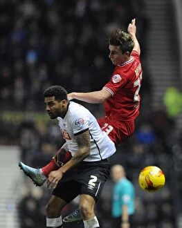 Images Dated 15th December 2015: Bristol City's Joe Bryan Battles for a Header Against Derby County's Cyrus Christie