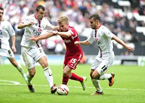 English Prints: Bristol City's Joe Bryan Breaks Away from Milton Keynes Dons Defense