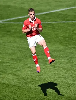 Celebration Prints: Bristol City's Joe Bryan Charges onto the Pitch Amidst Celebrations: Bristol City vs