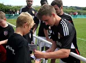 Bristol City's Joe Bryan Connects with Young Fan at Portishead Town Pre-Season Friendly