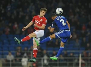 Images Dated 26th October 2015: Bristol City's Joe Bryan Contests Header Against Cardiff City's Lee Peltier in Championship Clash