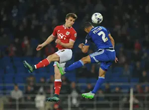 Cardiff City V Bristol City Prints: Bristol City's Joe Bryan Contests Header Against Cardiff City's Lee Peltier in Championship Clash