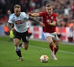 Images Dated 19th April 2016: Bristol City's Joe Bryan Fends Off Derby County's Johnny Russell in Championship Clash