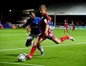 Images Dated 18th September 2012: Bristol City's Joe Bryan Outmaneuvers Gabriel Zakuani of Peterborough United in Championship Clash