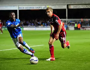 Framed Print : Bristol City's Joe Bryan Outmaneuvers Peterborough United's Gabriel Zakuani in Championship Clash Framed Print : Bristol City's Joe Bryan Outmaneuvers Peterborough United's Gabriel Zakuani in Championship Clash