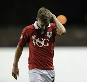 Images Dated 12th August 2014: Bristol City's Joe Bryan in Pain: Injury Sidelines Star Player Against Oxford United