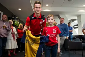 Bristol City's Joe Bryan Presents Sponsors with Signed Shirt after Championship Match against Birmingham City