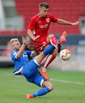 Images Dated 30th July 2016: Bristol City's Joe Bryan Tackled by Portsmouth's Jack Whatmough during Pre-Season Friendly