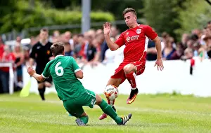 The Grove Prints: Bristol City's Joe Bryan Tackled in Pre-season Friendly Against Hengrove Athletic