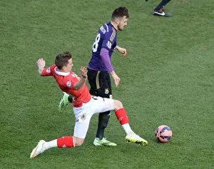 Bristol City V West Ham Prints: Bristol City's Joe Bryan Tackles Carl Jenkinson in FA Cup Fourth Round Clash
