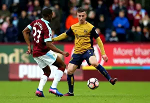 Burnley Prints: Bristol City's Joe Bryan and Tendayi Darikwa of Burnley Clash at Turf Moor
