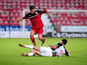 Images Dated 1st August 2012: Bristol City's Joe Edwards Tackled in Pre-Season Friendly Against Dunfermline Athletic