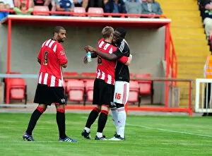 Images Dated 26th July 2010: Bristol Citys John Akinde with former team mate David Noble