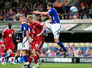 Images Dated 28th August 2010: Bristol City's Jon Stead Fights for Aerial Ball Amidst Ipswich Defenders Tommy Smith and Luke Hyam
