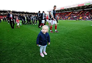 Bristol City V Barnsley Prints: Bristol City's Jon Stead Shares a Special Moment with Daughter at Ashton Gate Stadium during Bristol City v
