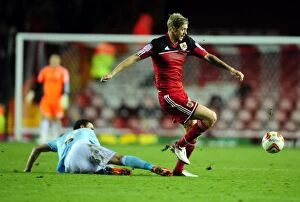 Images Dated 27th October 2012: Bristol City's Jon Stead Slips Past Corry Evans of Hull City in Championship Clash