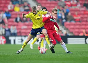 Bristol City's Jon Stead vs. Middlesbrough's Malaury Martin: A Battle for the Ball at Riverside Stadium, 2012