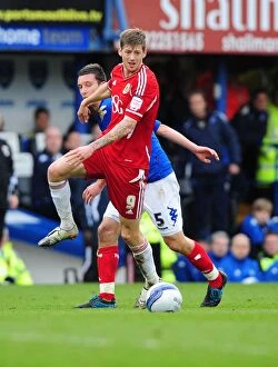 Images Dated 17th March 2012: Bristol City's Jon Stead vs Portsmouth's Jason Pearce: Battle for the Ball at Fratton Park, 2012