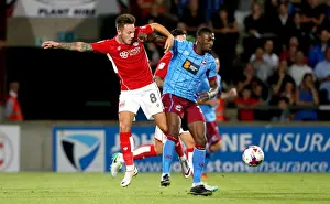 Glanford Park Prints: Bristol City's Josh Brownhill Tackles Hakeeb Adelakun in EFL Cup Clash at Scunthorpe United
