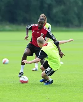 Images Dated 4th July 2011: Bristol Citys Kalifa Cisse battles for the ball with Bristol Citys Joe Lennox