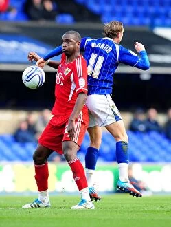 Images Dated 3rd March 2012: Bristol City's Kalifa Cisse vs. Ipswich Town's Lee Martin: Intense Battle for Ball Possession
