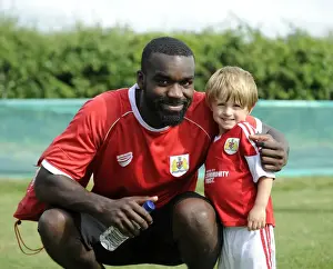 Bristol City's Karleigh Osborne and Young Fan Share a Moment at Portishead Town's The Playing Fields