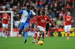 Bristol City's Kieran Agard Battles Past Hope Akpan for Ball Control