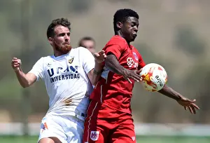Friendly Prints: Bristol City's Kieran Agard Fights for Possession in Pre-season Friendly Against UCAM