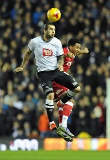 Images Dated 15th December 2015: Bristol City's Korey Smith Battles for a Header Against Derby County's Bradley Johnson