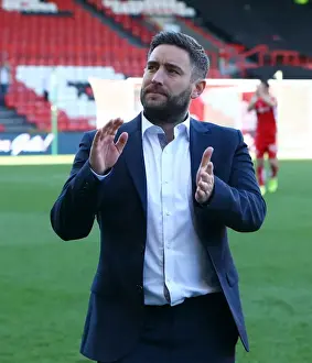 Bristol City's Lee Johnson and Ecstatic Fans Celebrate Promotion at Ashton Gate