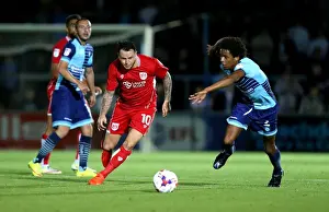 Framed Print : Bristol City's Lee Tomlin Dashes Past Wycombe Wanderers Sido Jombati in EFL League Cup Clash Framed Print : Bristol City's Lee Tomlin Dashes Past Wycombe Wanderers Sido Jombati in EFL League Cup Clash