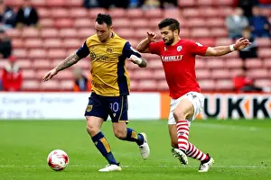 Barnsley V Bristol City Prints: Bristol City's Lee Tomlin Faces Off Against Barnsley's Sam Morsy in Sky Bet Championship Clash