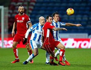 Images Dated 10th December 2016: Bristol City's Lee Tomlin Faces Off Against Huddersfield Town's Aaron Mooy in Championship Clash