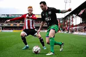 Brentford V Bristol City Prints: Bristol City's Lee Tomlin Fights Off Pressure from Brentford's Ryan Woods during Sky Bet Championship Match