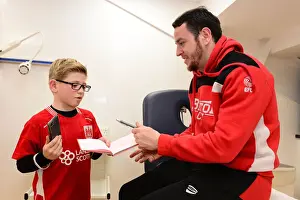 Bristol City V Fulham Prints: Bristol City's Lee Tomlin Meets and Signs for a Young Fan Before Fulham Match