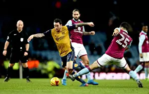 Bristol City's Lee Tomlin Outmaneuvers Aston Villa's Mile Jedinak in Sky Bet Championship Clash