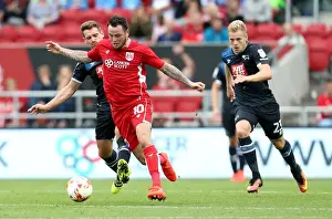 Framed Print : Bristol City's Lee Tomlin Outmaneuvers Derby County's Bryson and Vydra