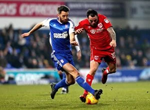 Images Dated 30th December 2016: Bristol City's Lee Tomlin Tackled by Ipswich Town's Cole Skuse during Sky Bet Championship Match