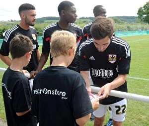 Images Dated 5th July 2014: Bristol City's Lewis Hall Signs Autographs at Portishead Town Pre-Season Friendly