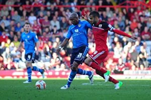 Images Dated 29th September 2012: Bristol City's Liam Fontaine Chases Down El-Hadji Diouf