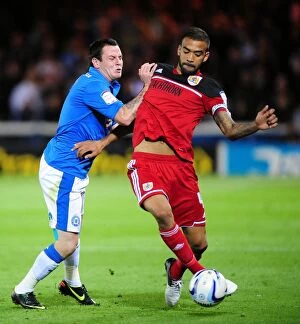 Images Dated 18th September 2012: Bristol City's Liam Fontaine Fouls by Lee Tomlin in Peterborough United Championship Clash