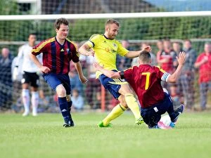 Images Dated 3rd July 2013: Bristol City's Liam Kelly Tackled in Pre-Season Friendly Against Ashton and Backwell United