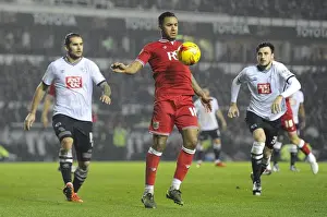 Framed Print : Bristol City's Liam Moore Battles for Control in Derby County Showdown