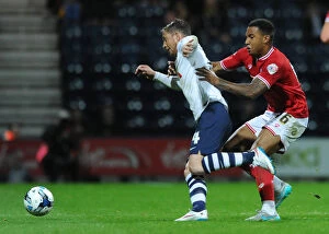 Images Dated 15th September 2015: Bristol City's Liam Moore Closes In on Preston North End's Joe Garner