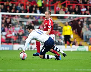 Bristol City V Preston North End Prints: Bristol City's Louis Carey Tackles Preston's Keith Treacy in Championship Clash at Ashton Gate Stadium
