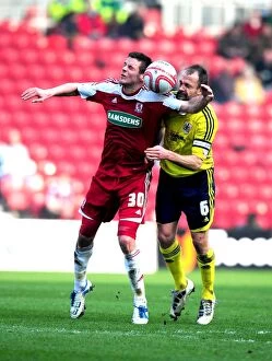 Images Dated 24th March 2012: Bristol City's Louis Carey vs. Middlesbrough's Lukas Jutkiewicz